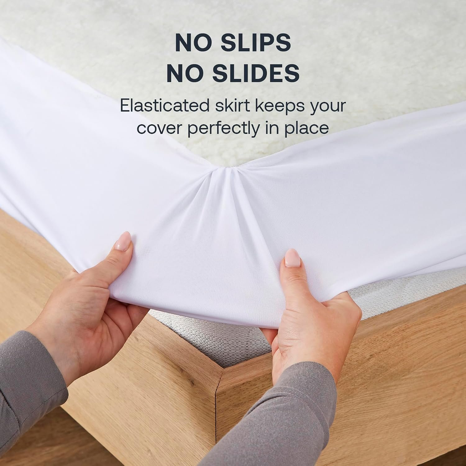 Elasticated skirt keeps the heated mattress cover in place